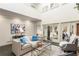 Living room featuring tall ceilings, fireplace, sliding glass doors to the backyard, and stylish decor at 5323 Presley Pl, Douglasville, GA 30135