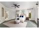 Main bedroom features a king bed, natural light, and an ensuite bath with built-in shelves at 5323 Presley Pl, Douglasville, GA 30135