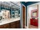 Stylish powder room with decorative mirror and vanity sink at 5323 Presley Pl, Douglasville, GA 30135