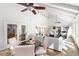 Inviting sunroom with a ceiling fan, stone floors, and lots of natural light at 5323 Presley Pl, Douglasville, GA 30135