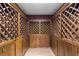 Unique wine cellar with custom wood lattice storage and wood floors at 5323 Presley Pl, Douglasville, GA 30135