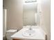 Bathroom featuring a white countertop vanity, large mirror, and standard toilet at 6797 Mahonia Pl, Lithonia, GA 30038