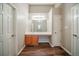 Bright bathroom featuring wood-look floors, neutral walls, and a well-lit vanity area at 6797 Mahonia Pl, Lithonia, GA 30038