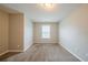 Neutral bedroom with carpet, window, and paint at 6797 Mahonia Pl, Lithonia, GA 30038