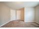 Comfortable bedroom showcasing soft carpet and neutral paint at 6797 Mahonia Pl, Lithonia, GA 30038