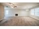 Large living room has a fireplace and an abundance of space at 6797 Mahonia Pl, Lithonia, GA 30038