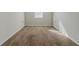 A bedroom features plush carpeting, neutral walls, and two built-in storage spaces at 1011 Buckhorn Bnd, Locust Grove, GA 30248