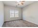 Neutral bedroom with carpet and a window, offering a blank canvas for personalization at 1011 Buckhorn Bnd, Locust Grove, GA 30248