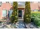 Close-up of a home's front door, framed by lush greenery, and a welcoming entrance at 1011 Buckhorn Bnd, Locust Grove, GA 30248