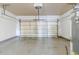 Bright garage with water heater and an open overhead door at 1011 Buckhorn Bnd, Locust Grove, GA 30248