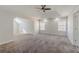 A large main bedroom boasts an expansive layout, vaulted ceilings, and plush carpeting at 1011 Buckhorn Bnd, Locust Grove, GA 30248