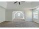 A large main bedroom boasts an expansive layout, vaulted ceilings, and plush carpeting at 1011 Buckhorn Bnd, Locust Grove, GA 30248