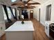 Open-concept living area featuring hardwood floors, vaulted ceiling, and kitchen island at 1575 Montreat Pl, Atlanta, GA 30311