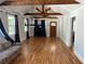 Bright open-concept living area featuring hardwood floors, vaulted ceiling, and natural light at 1575 Montreat Pl, Atlanta, GA 30311