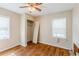 Bedroom with hardwood floors, two windows and a closet space needing restoration at 3119 Bellgreen Way, Decatur, GA 30032