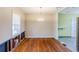 Dining room featuring hardwood floors, a chandelier light fixture and a large window at 3119 Bellgreen Way, Decatur, GA 30032