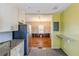 Bright kitchen with granite countertops connects to the living room with hardwood floors at 3119 Bellgreen Way, Decatur, GA 30032