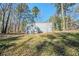 Backyard featuring additional structure and mature trees at 3524 Exeter Ct, Snellville, GA 30039