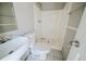 Bathroom featuring a sink, toilet, and shower-tub combo, offering basic functionality at 3524 Exeter Ct, Snellville, GA 30039