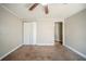 Bedroom with a ceiling fan, carpet, and a double-door closet, providing a comfortable and functional space at 3524 Exeter Ct, Snellville, GA 30039