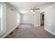 Bedroom featuring a window with a view, fan, and carpet providing a comfortable space at 3524 Exeter Ct, Snellville, GA 30039