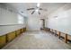 Living room with a ceiling fan and exposed wall framing ready to be customized at 3524 Exeter Ct, Snellville, GA 30039