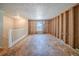 Spacious living room with exposed framework, adjacent stairwell and natural light at 3524 Exeter Ct, Snellville, GA 30039