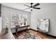 Cozy bedroom featuring hardwood floors, natural light, and a vintage-style decor at 4041 Blanton Sw Ave, Atlanta, GA 30331