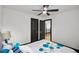 Bedroom with a ceiling fan, view to hallway, and two black doors and grey carpet at 4041 Blanton Sw Ave, Atlanta, GA 30331