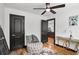 Elegant bedroom featuring dark door frames, modern decor, and polished hardwood floors at 4041 Blanton Sw Ave, Atlanta, GA 30331