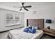 Bedroom featuring a large window, and a bed with decorative pillows at 4041 Blanton Sw Ave, Atlanta, GA 30331