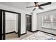 Bright bedroom featuring a ceiling fan and a window letting in plenty of natural light at 4041 Blanton Sw Ave, Atlanta, GA 30331