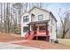 Inviting two-story home with bright red porch, black accents, and a cozy, well-lit exterior at 4041 Blanton Sw Ave, Atlanta, GA 30331