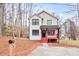 Charming two-story home featuring a red railed front porch and well-manicured front yard at 4041 Blanton Sw Ave, Atlanta, GA 30331