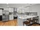 Kitchen featuring stainless steel appliances, a tile backsplash, an island, and modern pendant lighting at 4041 Blanton Sw Ave, Atlanta, GA 30331