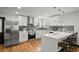 Modern kitchen featuring white cabinetry, stainless steel appliances, and a breakfast bar at 4041 Blanton Sw Ave, Atlanta, GA 30331