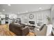 Bright, open living room featuring hardwood floors and an adjacent modern kitchen with bar seating at 4041 Blanton Sw Ave, Atlanta, GA 30331