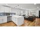 Open concept living room with hardwood floors, modern island kitchen and lots of natural light at 4041 Blanton Sw Ave, Atlanta, GA 30331