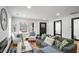 Stylish living room showcasing hardwood floors, comfortable seating, and a modern, bright aesthetic at 4041 Blanton Sw Ave, Atlanta, GA 30331