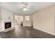 The living room is complete with a fireplace, fan and hard wood laminate floors at 5534 Somervale Ct, Douglasville, GA 30134