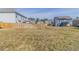 Large backyard with wood fence and view of neighborhood houses at 7434 Rudder Cir, Fairburn, GA 30213