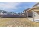 Spacious backyard featuring a patio and wood fence and view of neighborhood houses at 7434 Rudder Cir, Fairburn, GA 30213