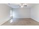 Spacious bedroom with neutral walls, large window, and carpeted flooring at 7434 Rudder Cir, Fairburn, GA 30213