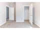 Bedroom with plush carpet and doors to closet and other room at 7434 Rudder Cir, Fairburn, GA 30213