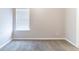This bedroom features carpet flooring and a window, creating a serene and comfortable living space at 7434 Rudder Cir, Fairburn, GA 30213