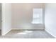 Cozy bedroom featuring plush carpet, a bright window, and neutral paint at 7434 Rudder Cir, Fairburn, GA 30213