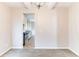 Bright dining room featuring neutral walls, carpeted floor, and view into kitchen at 7434 Rudder Cir, Fairburn, GA 30213