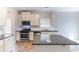 Well-equipped kitchen featuring stainless steel appliances and granite countertops at 7434 Rudder Cir, Fairburn, GA 30213