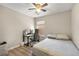 Cozy bedroom featuring a ceiling fan, a computer desk, and hardwood floors at 805 Pleasant Hill Rd # 171, Lilburn, GA 30047