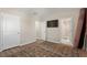 Spacious room with luxury vinyl flooring, doors to a bathroom, and a walk-in closet at 805 Pleasant Hill Rd # 171, Lilburn, GA 30047